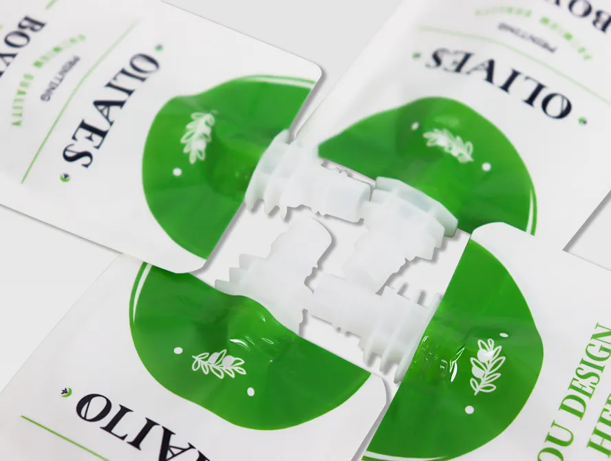 Overhead shot of multiple spout pouches arranged in a circular layout showing brand logo