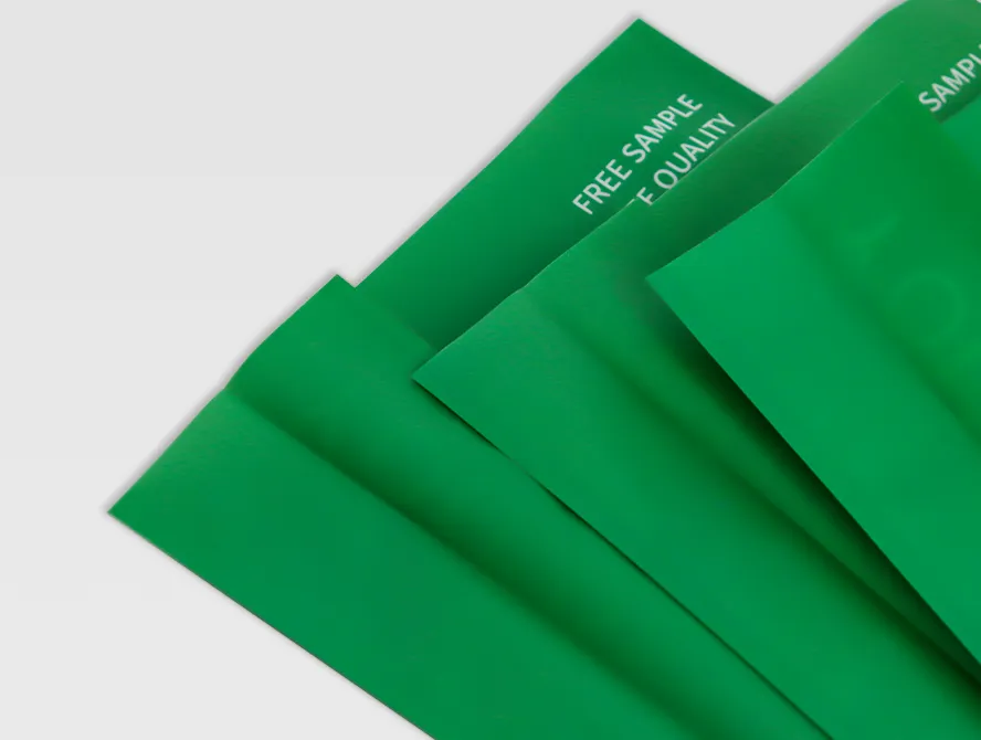 Partially opened green packaging bags highlighting edge details and print quality