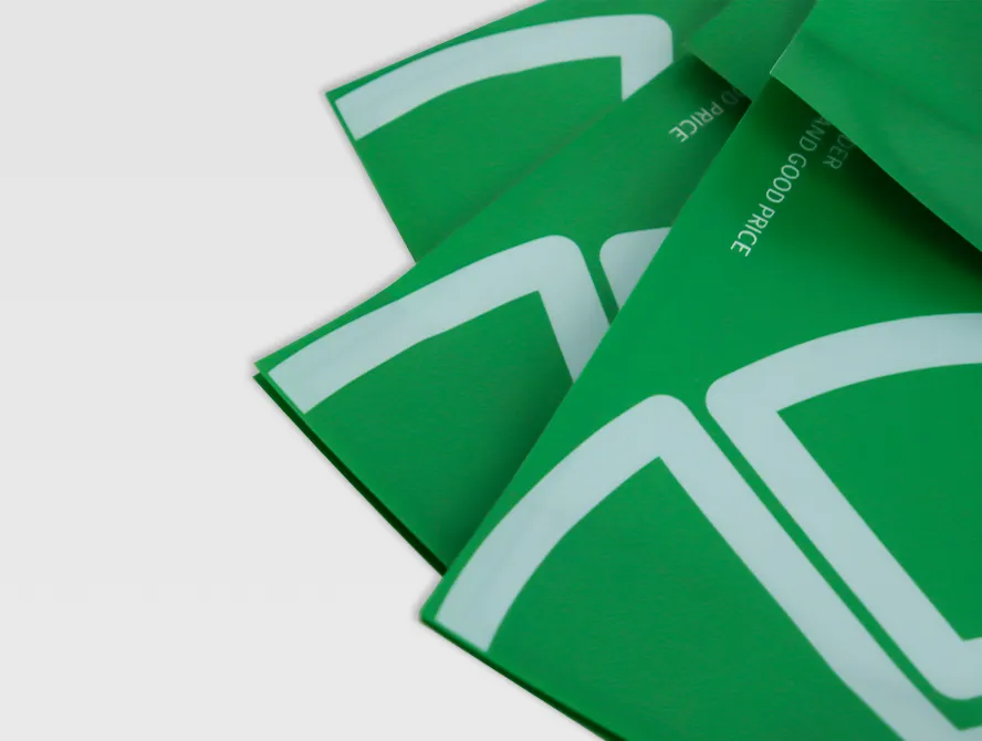 Close up of custom green pouch showing logo print and textured material