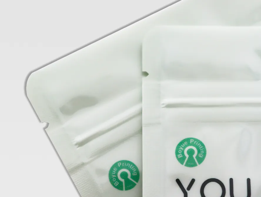 Top down detail view of stand up pouch closures, highlighting zipper and branding label