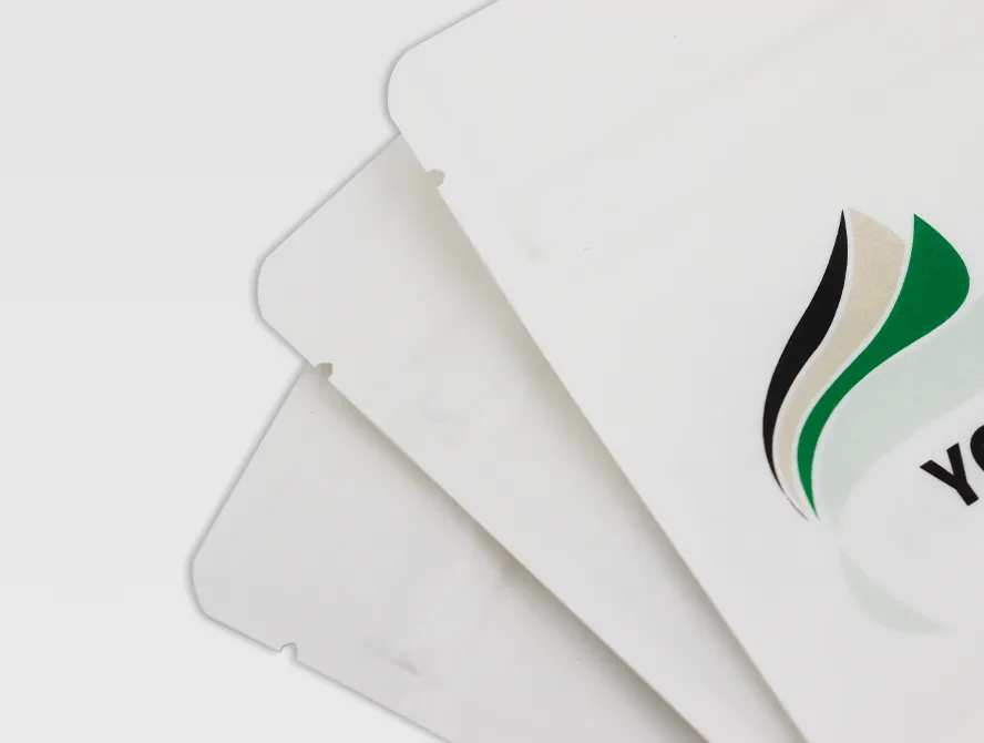 Stack of white ziplock kraft pouches partially overlapping, highlighting thickness and texture