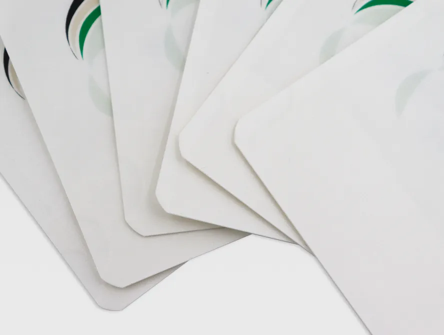 Close up view of layered white kraft bags with ziplock closure and green logo detail