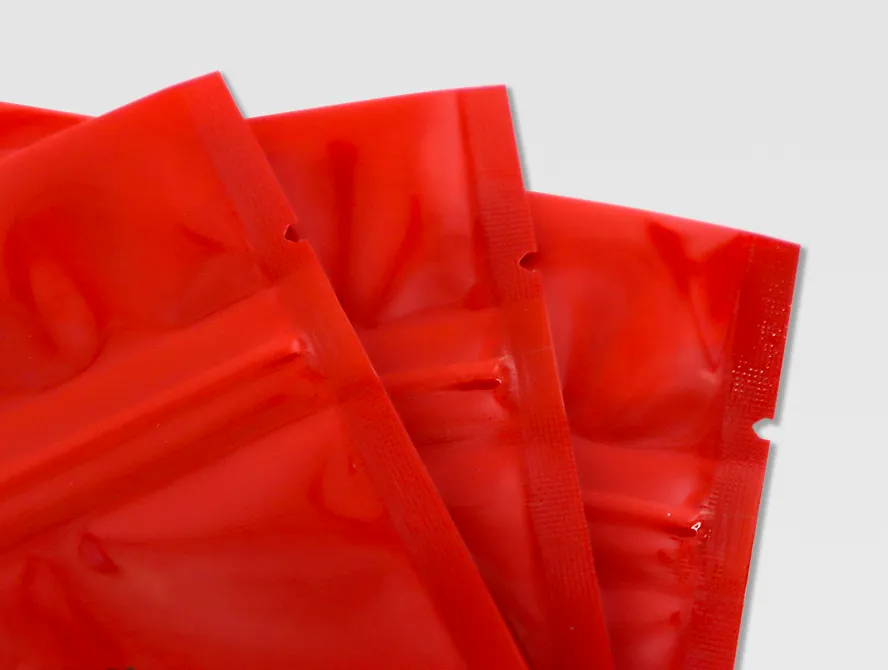 Red spice pouches stacked flat for bulk packaging display