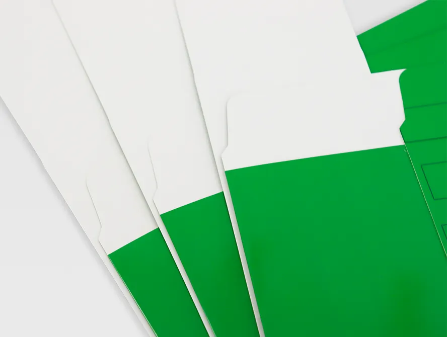 Unassembled green display boxes stacked