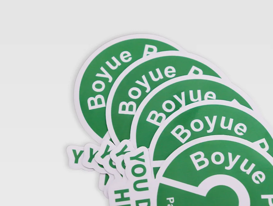 Stack of custom green die cut stickers