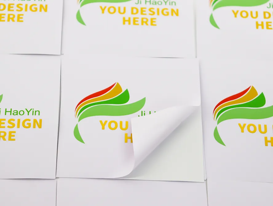 Multiple gold foil logo stickers on sheet
