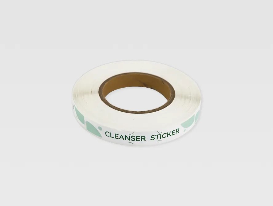 Cleaning cream label roll with green text