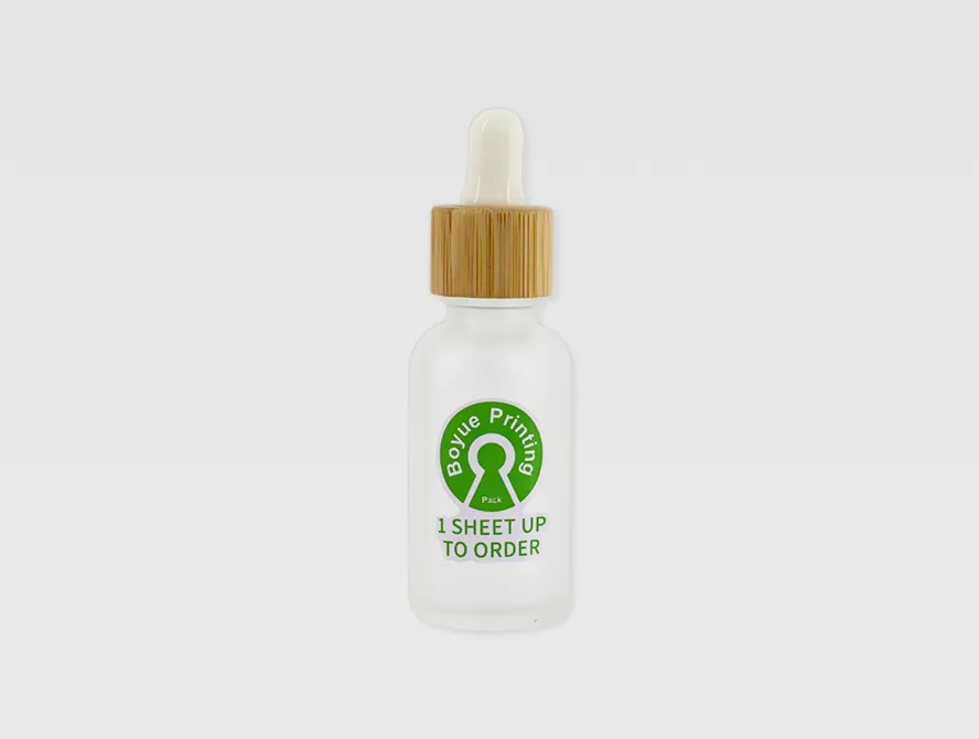 Dropper bottle with kiss cut sticker applied