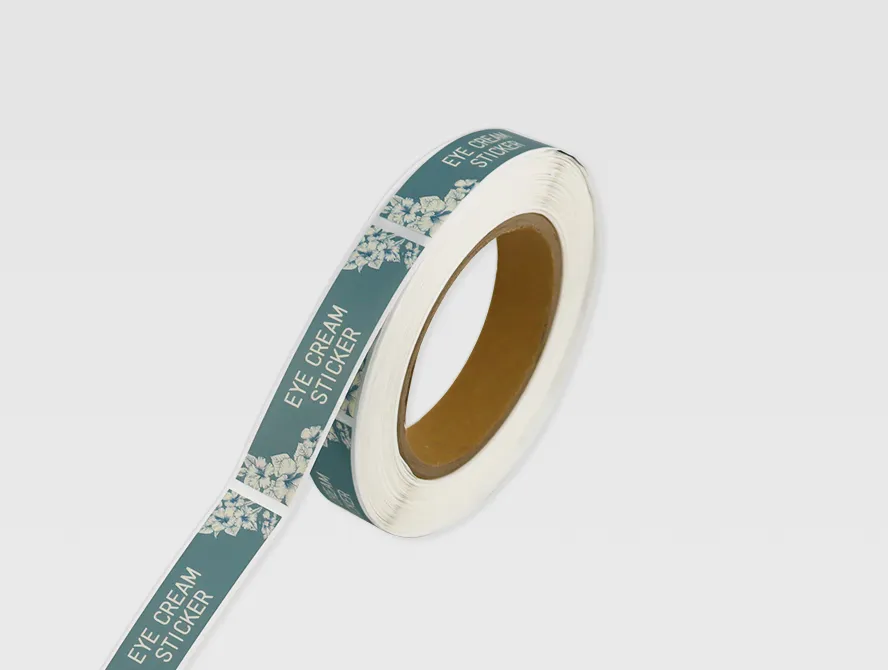 Printed eye cream label roll with white text