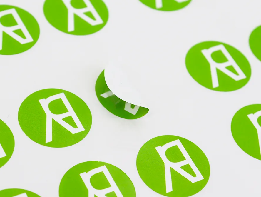 Custom stickers on sheet with bold green design