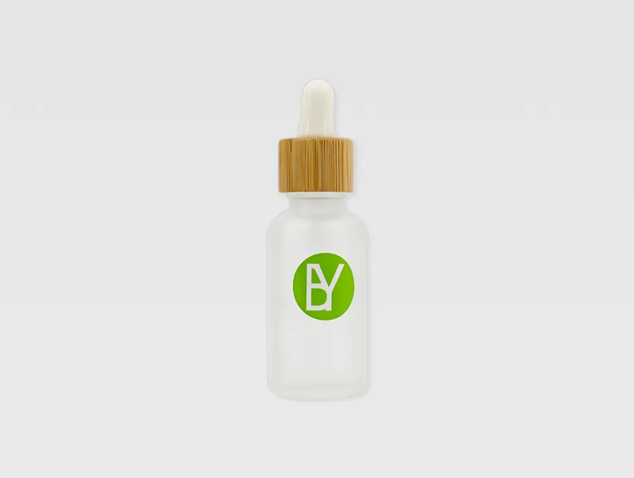 Dropper bottle with custom round sticker applied