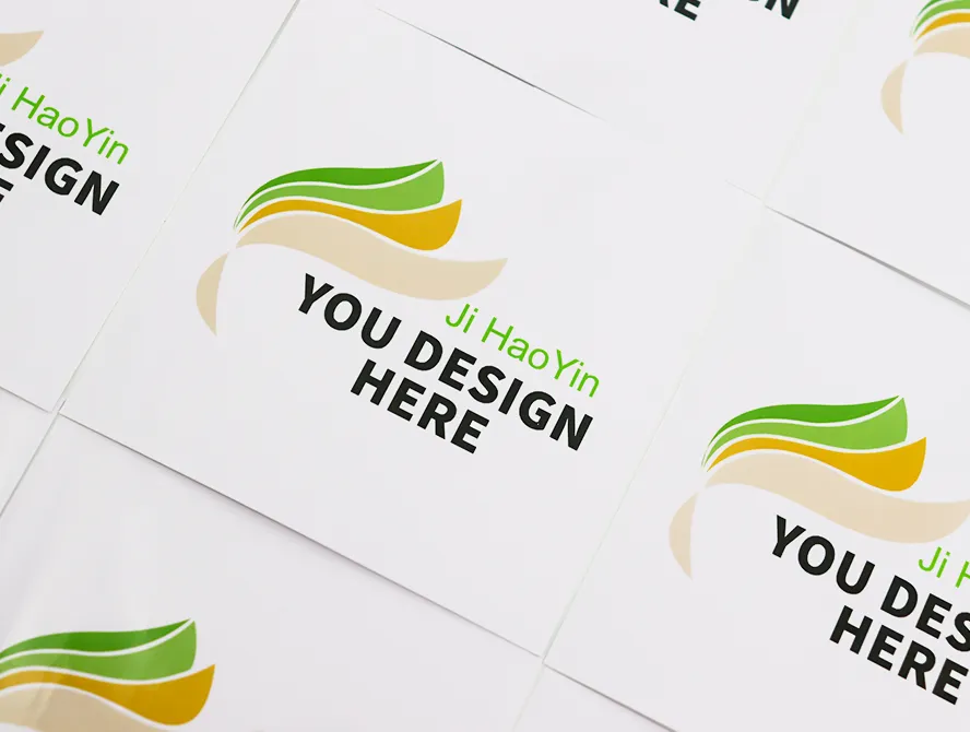 Close up of white vinyl stickers with green and yellow icon