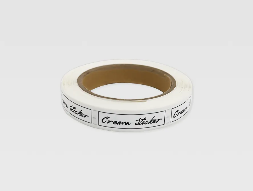 Custom face cream label roll with black text