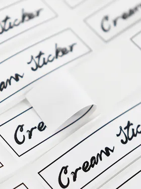 Close up of white face cream labels with script font (2)