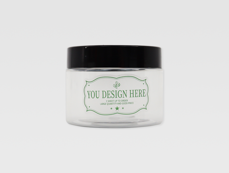Glass candle jar with custom green and white label applied