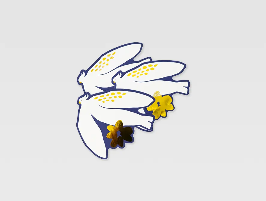 Cluster of custom gold foil flower stickers on a flat surface