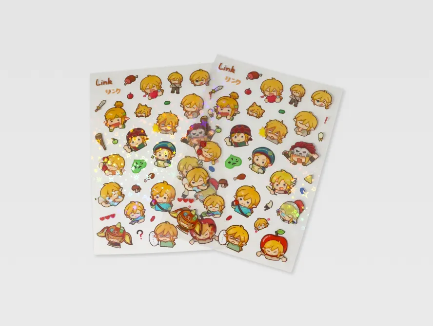 Multiple clear kiss cut sticker sheets laid out on white background