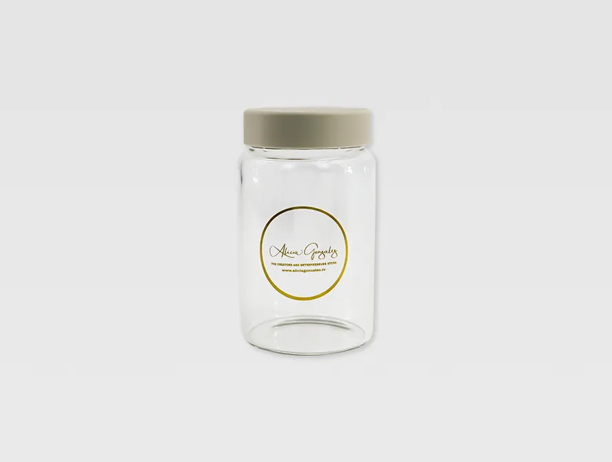 Glass jar with a gold foil transparent label applied on the front