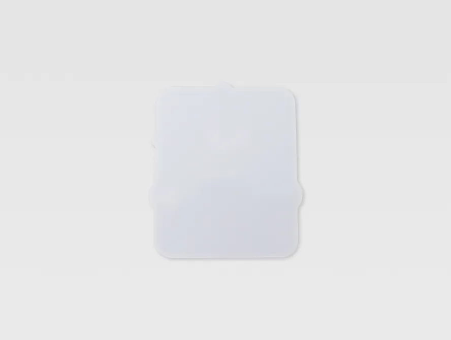 Back view of a custom laptop sticker showing adhesive side