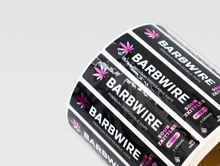 Close up of glossy uv labels on roll with bold typography