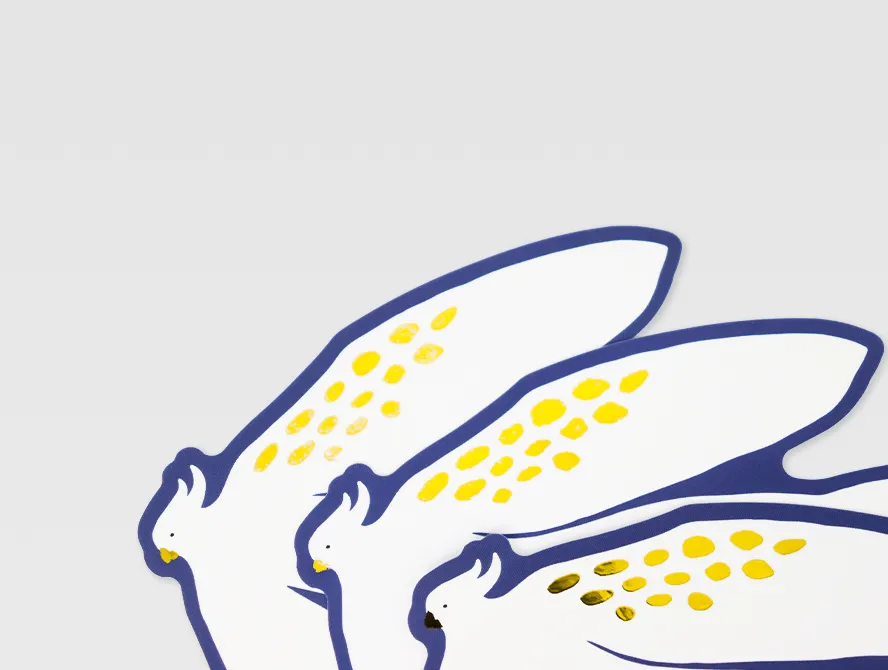 Close up of multiple white and gold foil floral stickers