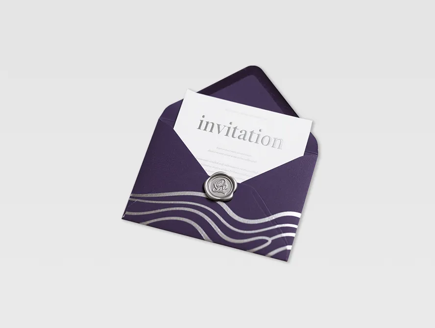 Dark purple envelope holding minimalist custom invitation