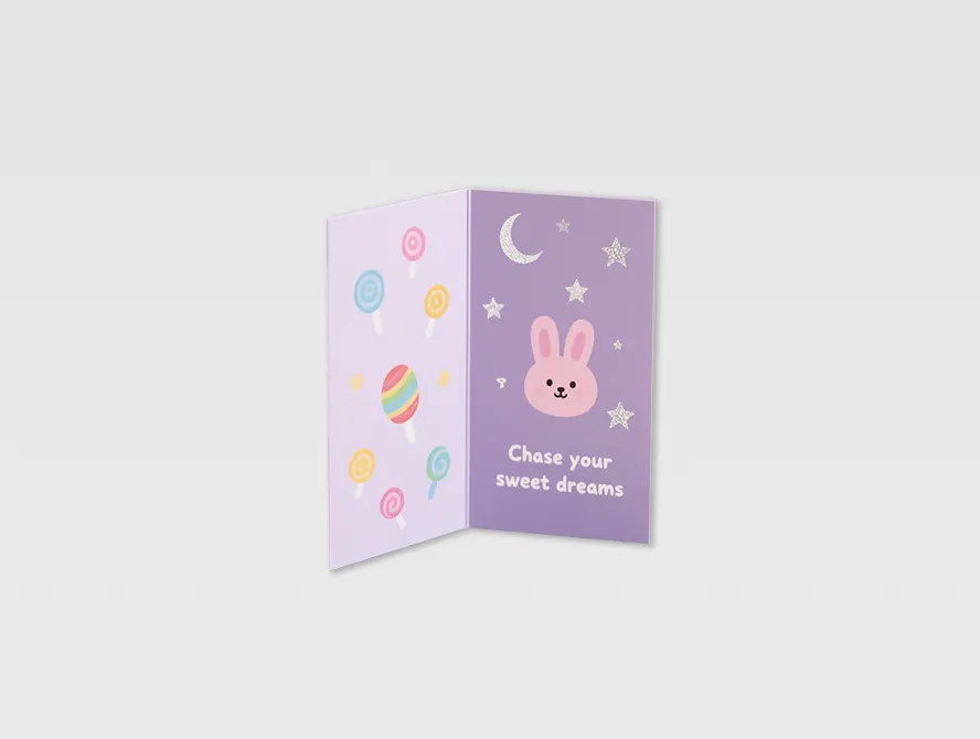 Purple birthday folding card featuring candles and gifts