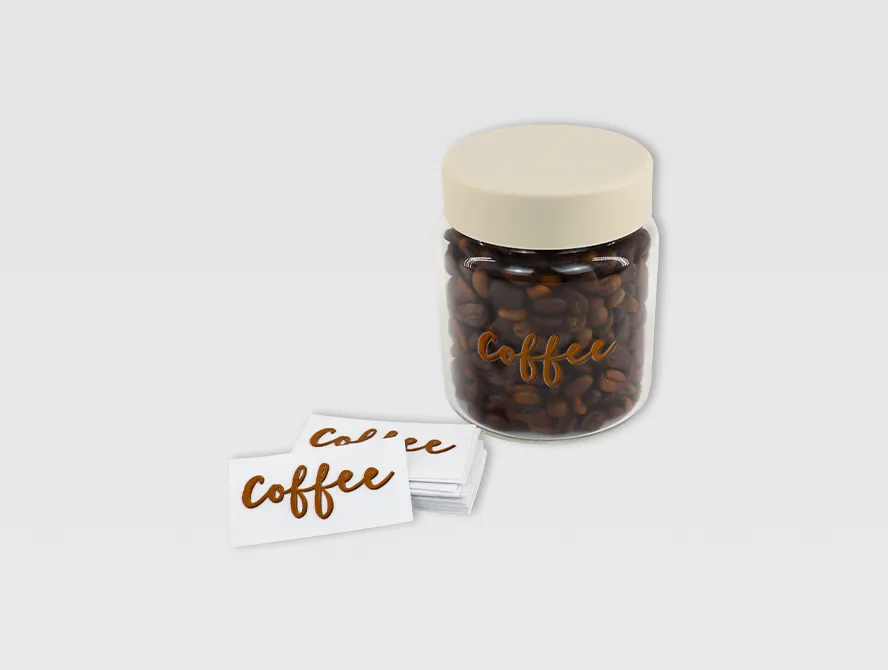 Glass jar decorated with uv dtf sticker and coffee bean text
