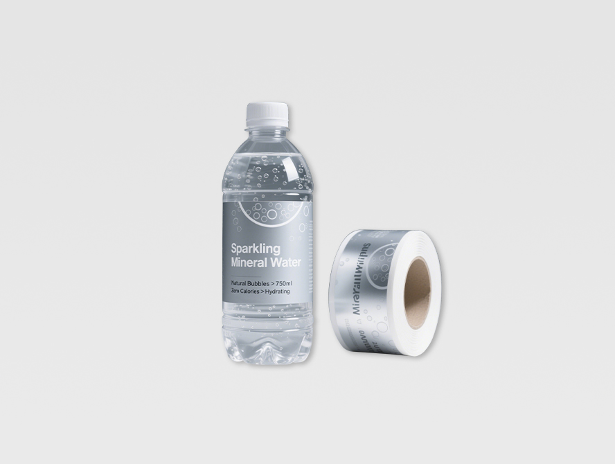 Black custom label on bottled water with printed label roll