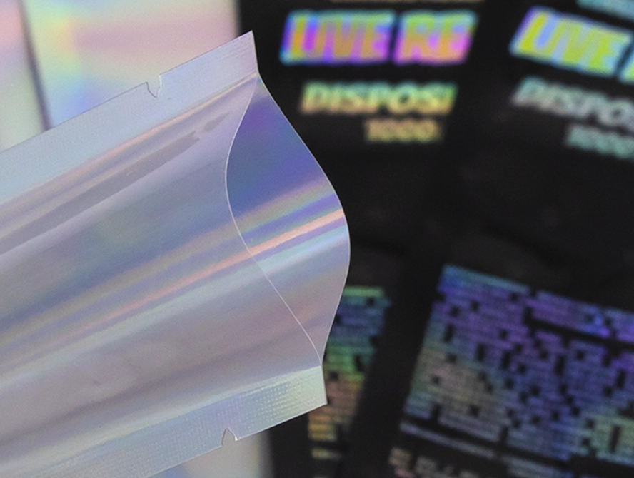 Shiny holographic foil packaging pouches with rainbow reflection