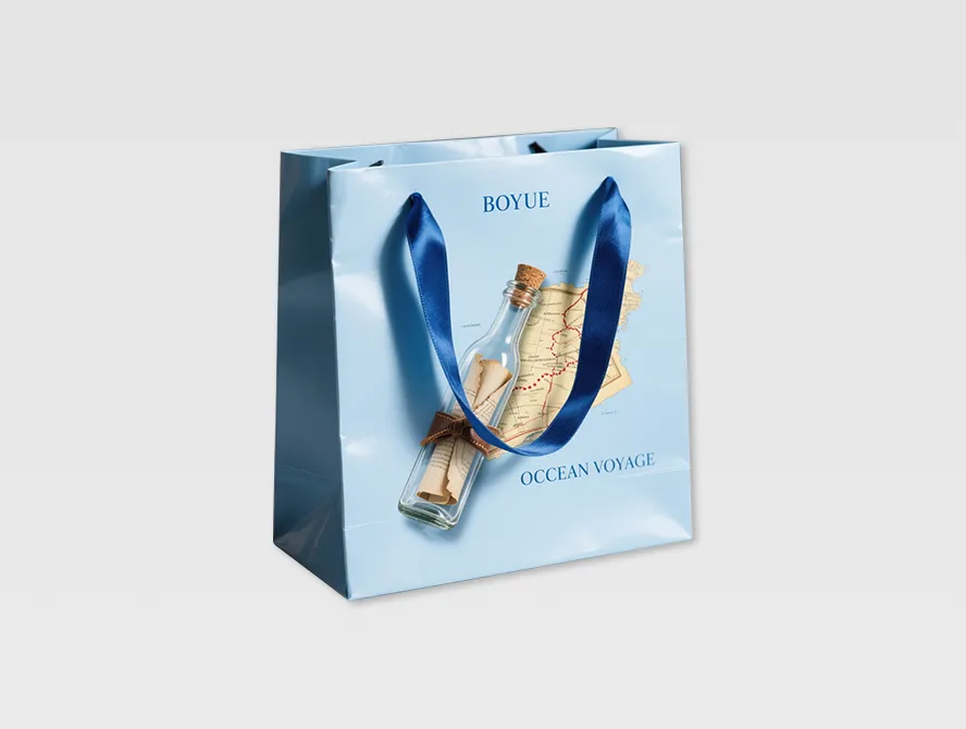 Blue custom gift bag with floral illustration and rope handles