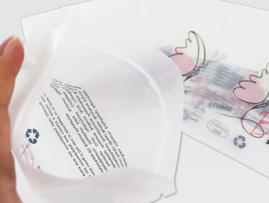 Hand peeling open a transparent 3 side seal pouch with a printed insert