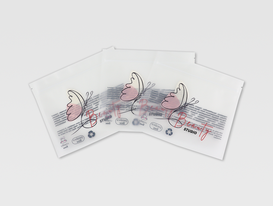 Set of two clear flat pouches with product cards visible through the plastic