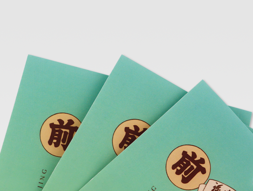Stack of folded white kraft paper bags with custom logo sticker on front