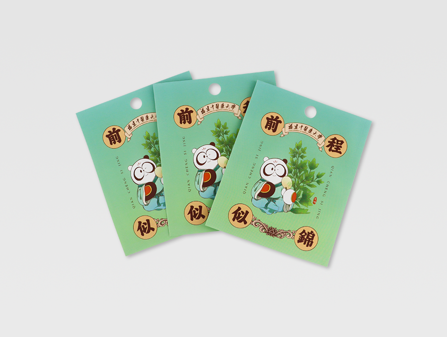 Three flat white kraft paper 3 side seal pouches with colorful printed design