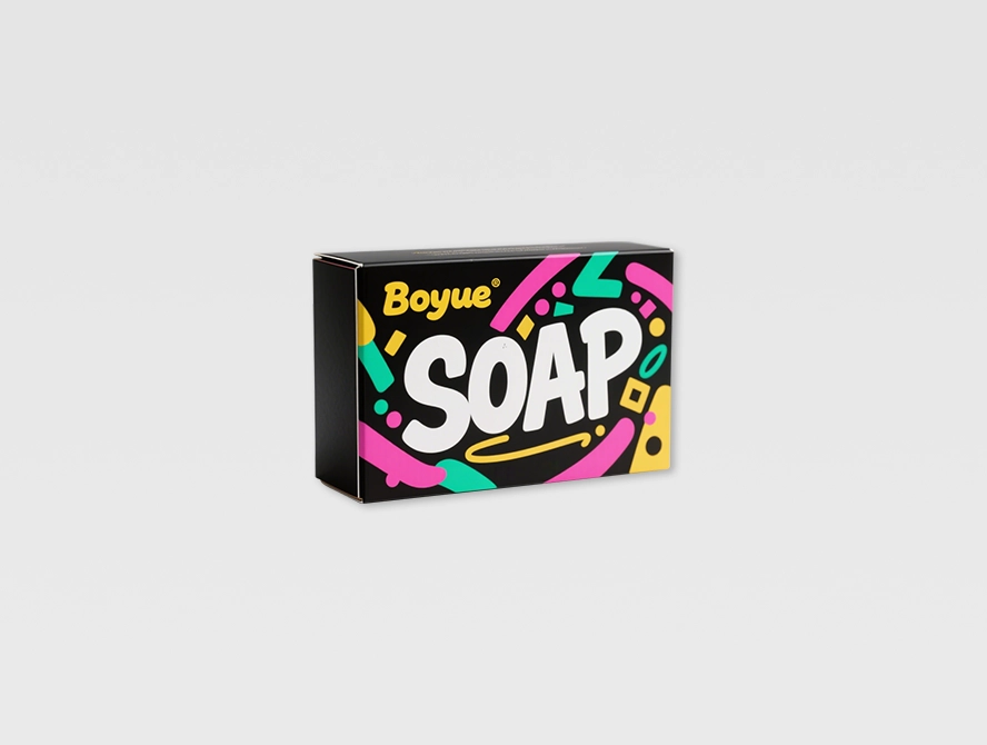 Bold black soap packaging with neon green and pink design