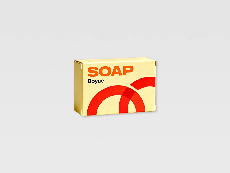 Soap box with yellow and red arc design and simple branding