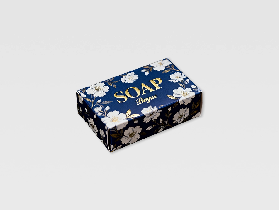 Dark navy soap box with floral patterns and luxury vibe