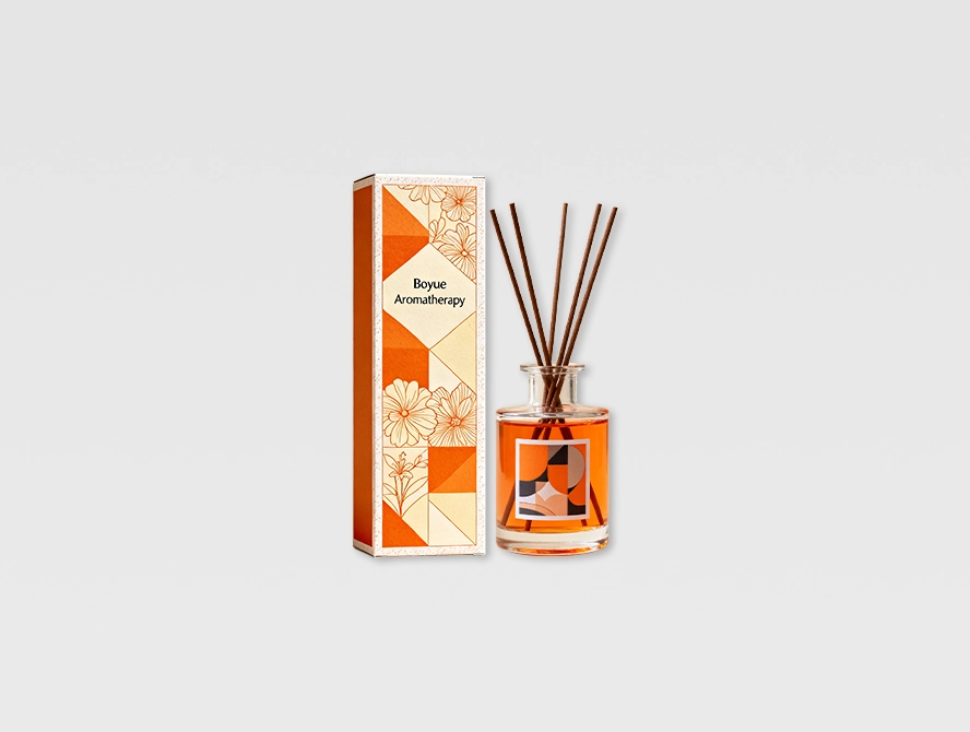 Orange reed diffuser packaging box with minimalist botanical print
