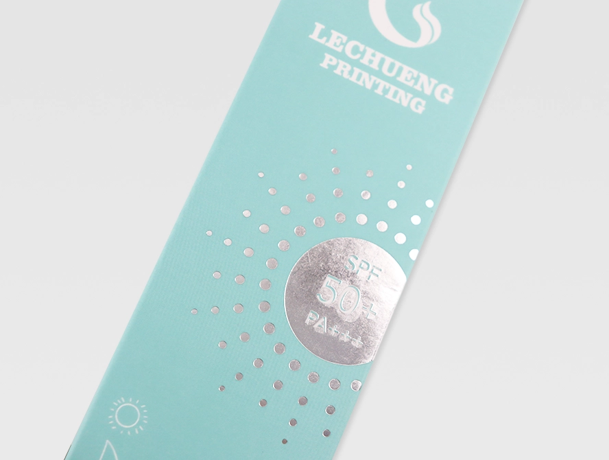 Close up of tuck flap opening on a teal straight tuck end box