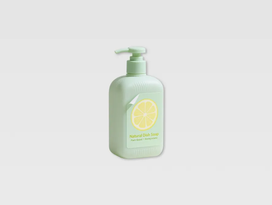 Green body wash bottle labeled with removable product sticker