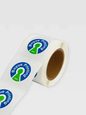 Angled view of custom round logo stickers on roll (2)