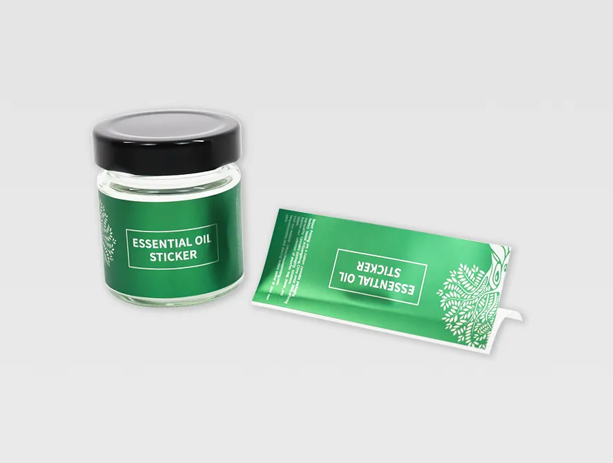 Essential oil jar with applied label and matching sticker